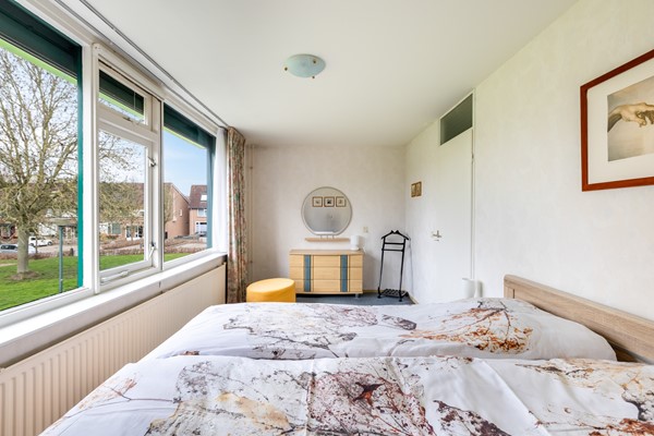 Foto - Te koop: tussenwoning gelegen aan groenvoorziening